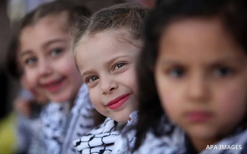 Palestinian children take part in a celebration to mark the Children's Day, at University College of Applied Sciences in Gaza city on April 5, 2015. Photo by Ashraf Amra