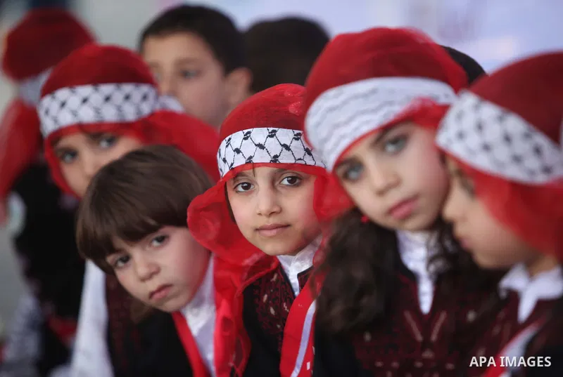 Palestinian children take part in a celebration to mark the Children's Day, at University College of Applied Sciences in Gaza city on April 5, 2015. Photo by Ashraf Amra