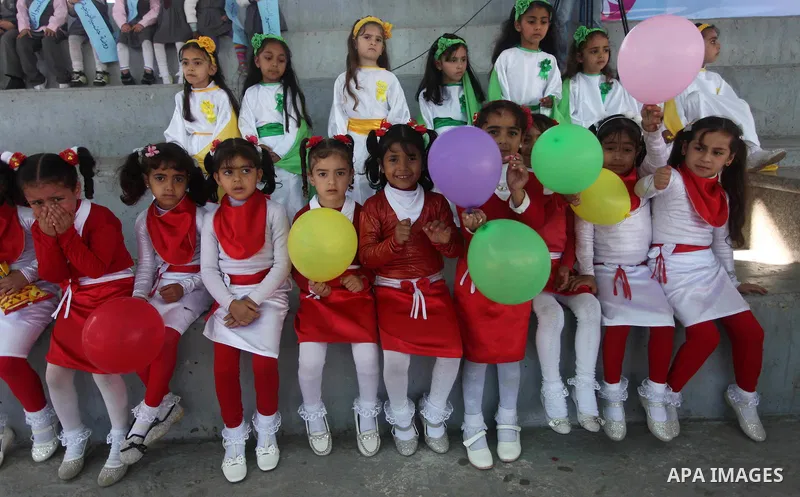 Palestinian children take part in a celebration to mark the Children's Day, at University College of Applied Sciences in Gaza city on April 5, 2015. Photo by Ashraf Amra