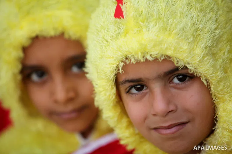 Palestinian children take part in a celebration to mark the Children's Day, at University College of Applied Sciences in Gaza city on April 5, 2015. Photo by Ashraf Amra