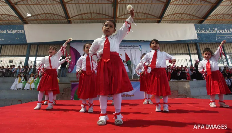 Palestinian children take part in a celebration to mark the Children's Day, at University College of Applied Sciences in Gaza city on April 5, 2015. Photo by Ashraf Amra