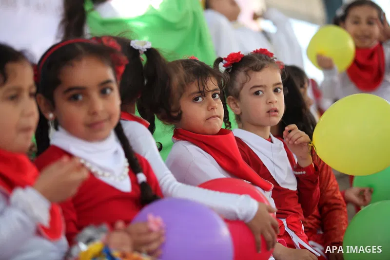 Palestinian children take part in a celebration to mark the Children's Day, at University College of Applied Sciences in Gaza city on April 5, 2015. Photo by Ashraf Amra