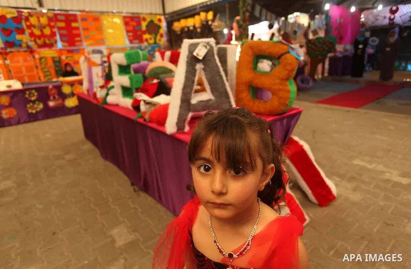 Palestinian children take part in a celebration to mark the Children's Day, at University College of Applied Sciences in Gaza city on April 5, 2015. Photo by Ashraf Amra