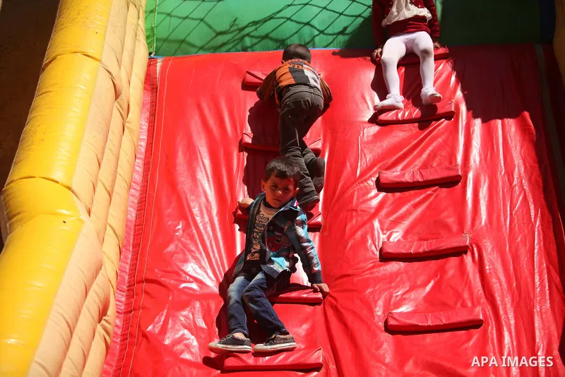 Palestinian children take part in a celebration to mark the Children's Day, at University College of Applied Sciences in Gaza city on April 5, 2015. Photo by Ashraf Amra