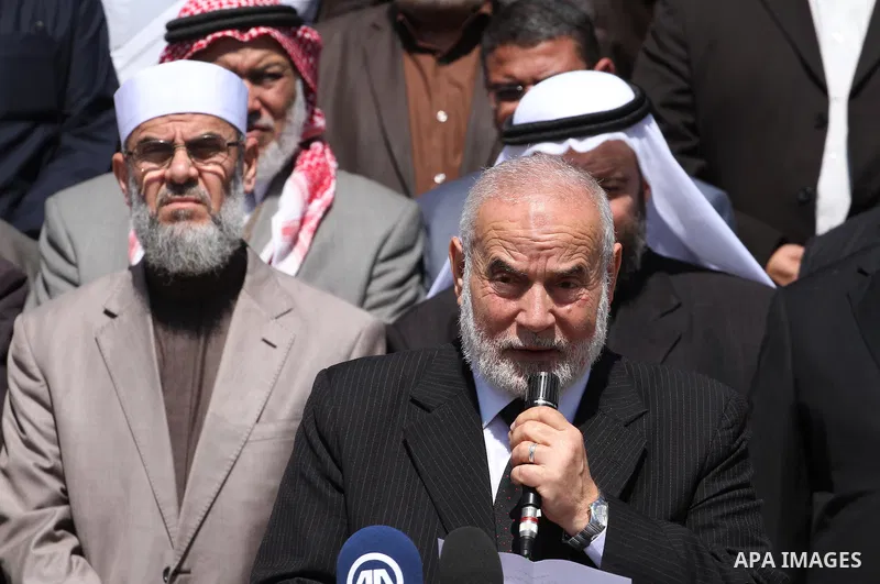 Deputy of the Legislative Council, Ahmed Bahar, speaks during a protest to show solidarity with the Palestinians living in Syria's Yarmouk camp, which is besieged by government forces and has been largely overrun by jiha...