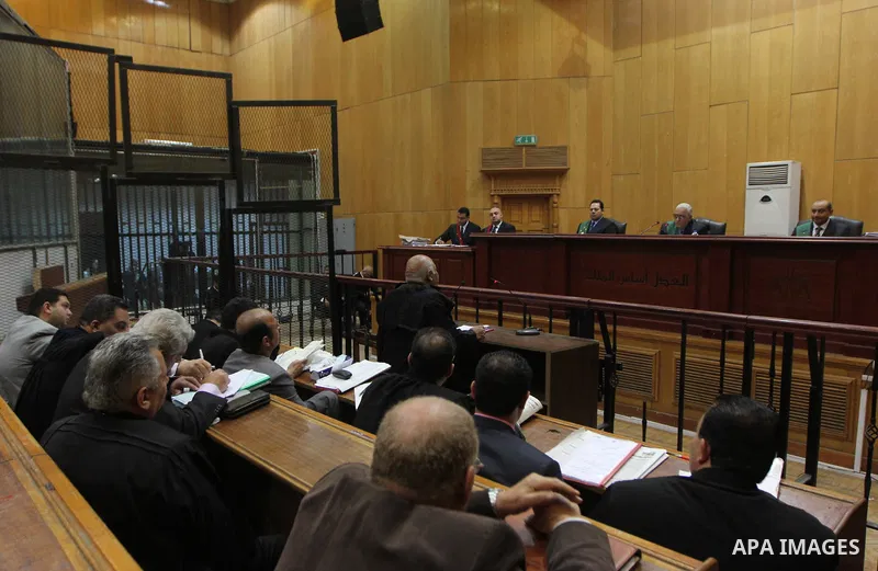 A lawyer speaks to judges during the trial of suspects in the 'Port Said Massacre' case in Cairo on April 6, 2015. The defendants were originally given sentences ranging from 15 years to life in prison. They were convict...