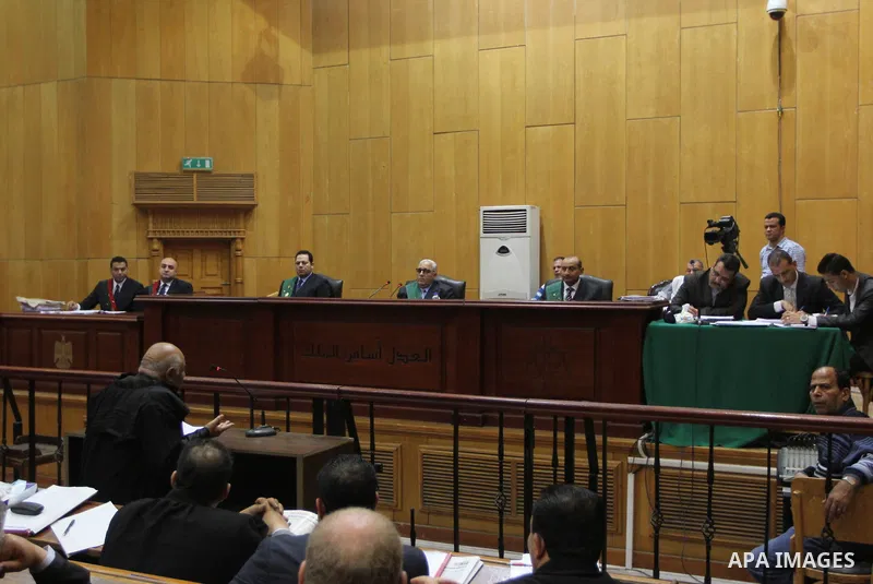 The Judge speaks during the trial of suspects in the 'Port Said Massacre' case in Cairo on April 6, 2015. The defendants were originally given sentences ranging from 15 years to life in prison. They were convicted of the...