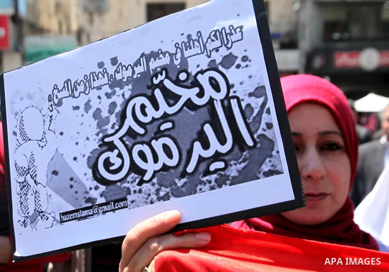 Palestinians take part a protest to show solidarity with the Palestinians living in Syria's Yarmouk camp, which is besieged by government forces and has been largely overrun by jihadist fighters, in the West bank city of...