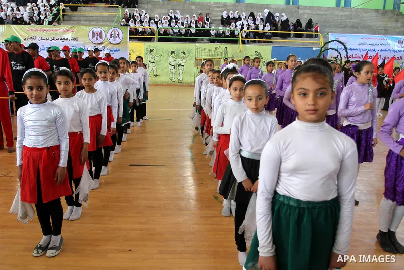 Palestinian students demonstrate their skills during the sports festival organised by the ministry of education in Rafah in the southern Gaza Strip, April 6, 2015. Photo by Abed Rahim Khatib