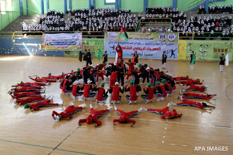Palestinian students demonstrate their skills during the sports festival organised by the ministry of education in Rafah in the southern Gaza Strip, April 6, 2015. Photo by Abed Rahim Khatib