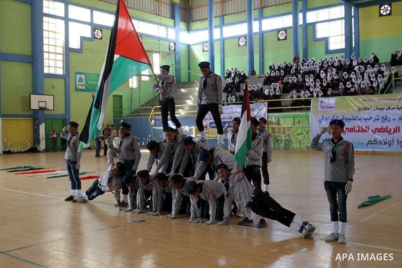 Palestinian students demonstrate their skills during the sports festival organised by the ministry of education in Rafah in the southern Gaza Strip, April 6, 2015. Photo by Abed Rahim Khatib