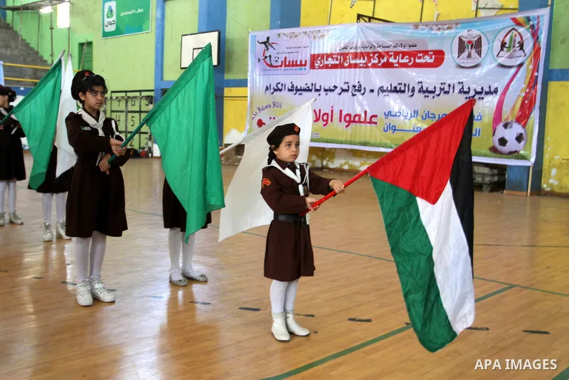 Palestinian students demonstrate their skills during the sports festival organised by the ministry of education in Rafah in the southern Gaza Strip, April 6, 2015. Photo by Abed Rahim Khatib