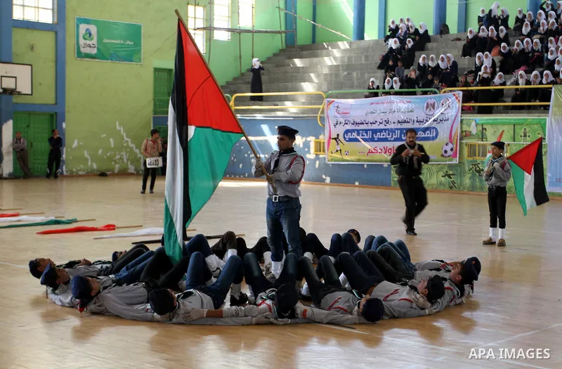 Palestinian students demonstrate their skills during the sports festival organised by the ministry of education in Rafah in the southern Gaza Strip, April 6, 2015. Photo by Abed Rahim Khatib