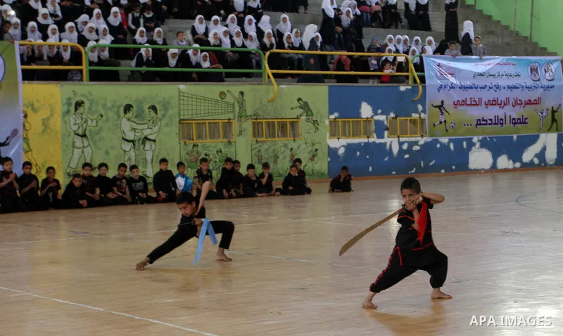 Palestinian students demonstrate their skills during the sports festival organised by the ministry of education in Rafah in the southern Gaza Strip, April 6, 2015. Photo by Abed Rahim Khatib