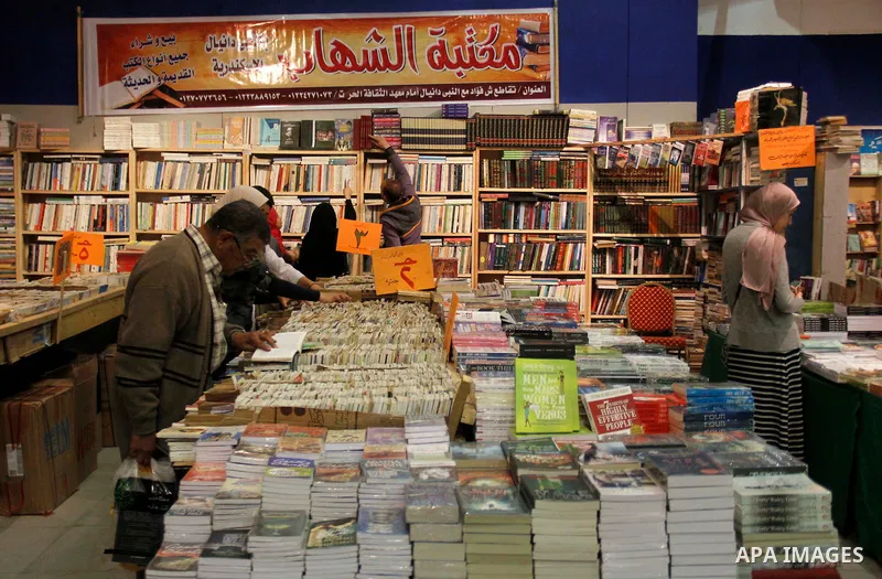 Egyptians attend the eleventh Alexandrina International Book Fair, in Alexandria Egypt on April 06, 2015. Photo by Amr Sayed