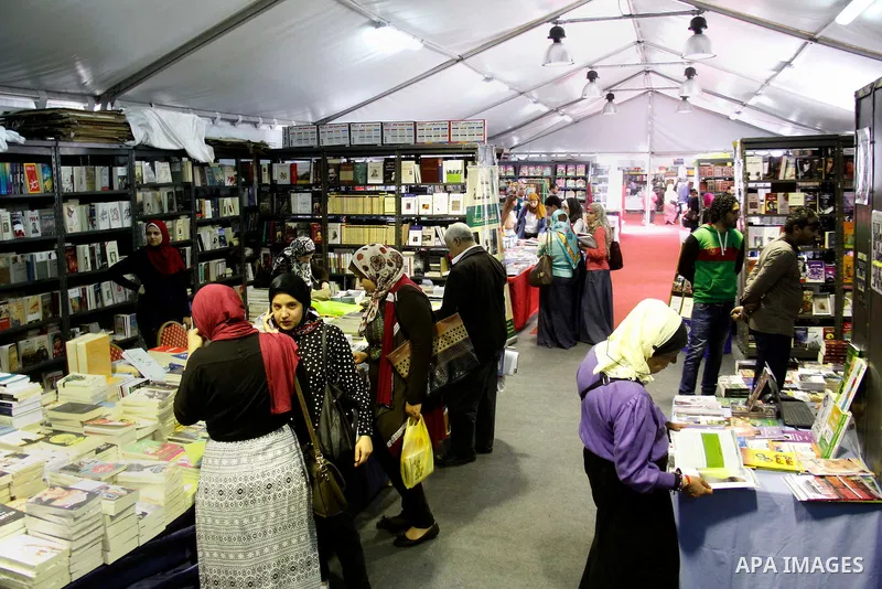 Egyptians attend the eleventh Alexandrina International Book Fair, in Alexandria Egypt on April 06, 2015. Photo by Amr Sayed