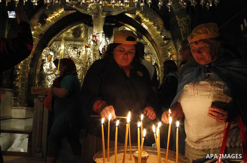 Christian worshipers pray in the Church of the Holy Sepulcher, traditionally believed by many to be the site of the crucifixion and burial of Jesus Christ, part of their Easter pilgrimage to the Holy Land, in Jerusalem's...