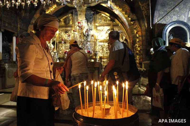 Christian worshipers pray in the Church of the Holy Sepulcher, traditionally believed by many to be the site of the crucifixion and burial of Jesus Christ, part of their Easter pilgrimage to the Holy Land, in Jerusalem's...