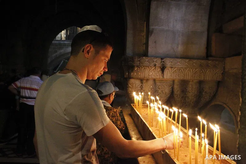 Christian worshipers pray in the Church of the Holy Sepulcher, traditionally believed by many to be the site of the crucifixion and burial of Jesus Christ, part of their Easter pilgrimage to the Holy Land, in Jerusalem's...