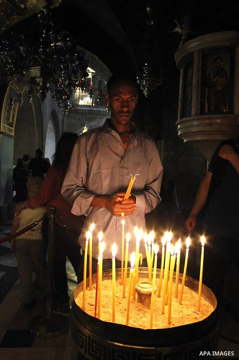 Christian worshipers pray in the Church of the Holy Sepulcher, traditionally believed by many to be the site of the crucifixion and burial of Jesus Christ, part of their Easter pilgrimage to the Holy Land, in Jerusalem's...