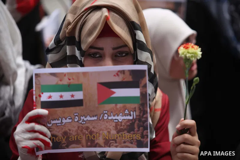 Palestinian students take part a protest to show solidarity with the Palestinians living in Syria's Yarmouk camp, which is besieged by government forces and has been largely overrun by jihadist fighters, in Gaza city on...