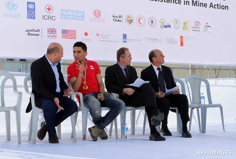 UN humanitarian coordinator James Rawley, and Palestinian Arab Idol Mohammed Assaf attend an event organized by United Nations at a U.N-run training center in Khan Younis in the southern Gaza Strip April 8, 2015. The eve...