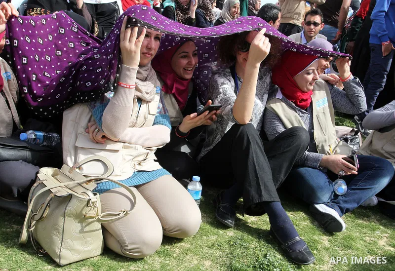 Palestinian and foreign activists attend an event organized by United Nations at a U.N-run training center in Khan Younis in the southern Gaza Strip April 8, 2015. The event was aimed at raising awareness on the impact o...