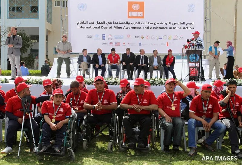 UN humanitarian coordinator James Rawley, and Palestinian Arab Idol Mohammed Assaf attend an event organized by United Nations at a U.N-run training center in Khan Younis in the southern Gaza Strip April 8, 2015. The eve...