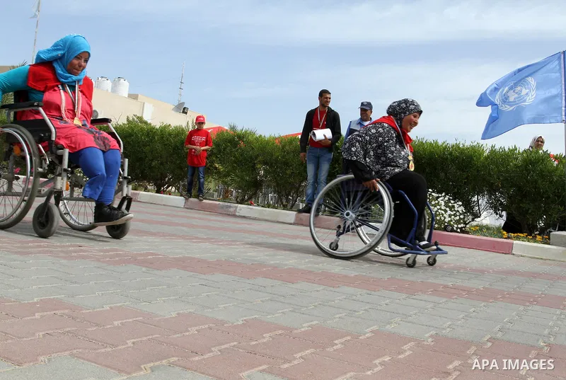 Disabled Palestinians participate in a race during an event organized by United Nations at a U.N-run training center in Khan Younis in the southern Gaza Strip April 8, 2015. The event was aimed at raising awareness on th...