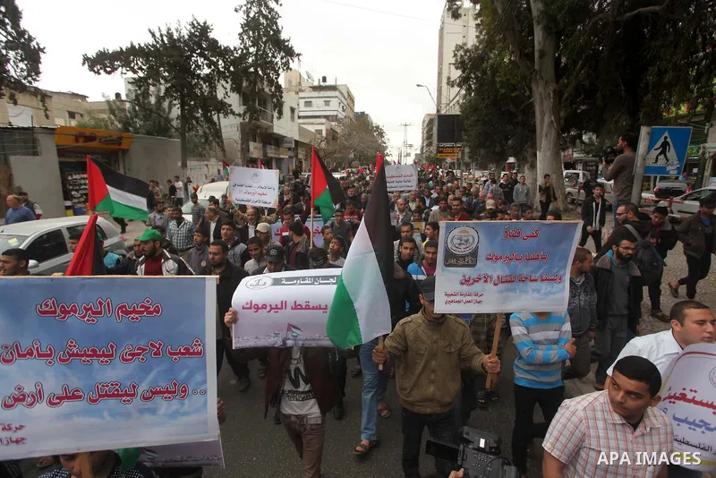 Palestinian factions take part a protest to show solidarity with the Palestinians living in Syria's Yarmouk camp, which is besieged by government forces and has been largely overrun by jihadist fighters, in Gaza city on...