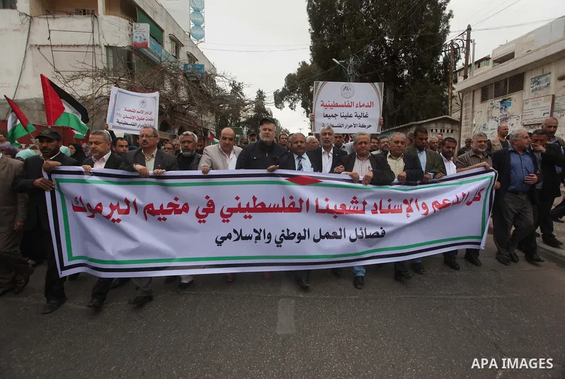 Palestinian factions take part a protest to show solidarity with the Palestinians living in Syria's Yarmouk camp, which is besieged by government forces and has been largely overrun by jihadist fighters, in Gaza city on...