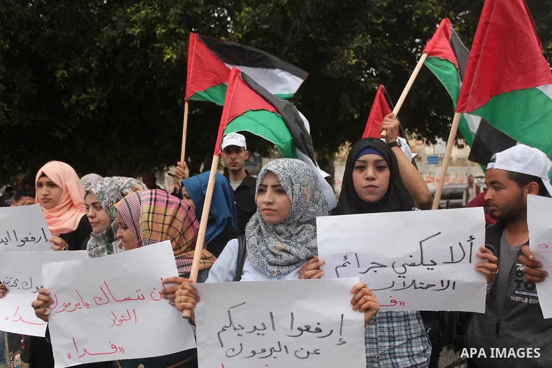 Palestinian factions take part a protest to show solidarity with the Palestinians living in Syria's Yarmouk camp, which is besieged by government forces and has been largely overrun by jihadist fighters, in Gaza city on...
