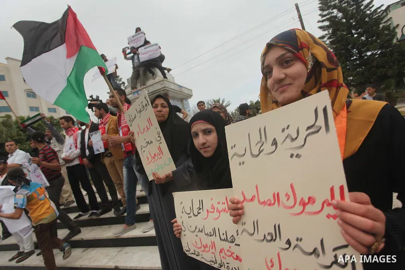 Palestinian factions take part a protest to show solidarity with the Palestinians living in Syria's Yarmouk camp, which is besieged by government forces and has been largely overrun by jihadist fighters, in Gaza city on...