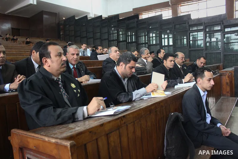 lawyers attend the trial of Muslim brotherhood leaders in Cairo, April 11, 2015. An Egyptian court sentenced Mohamed Badie, the leader of the outlawed Muslim Brotherhood, and 13 other senior members of the group to death...