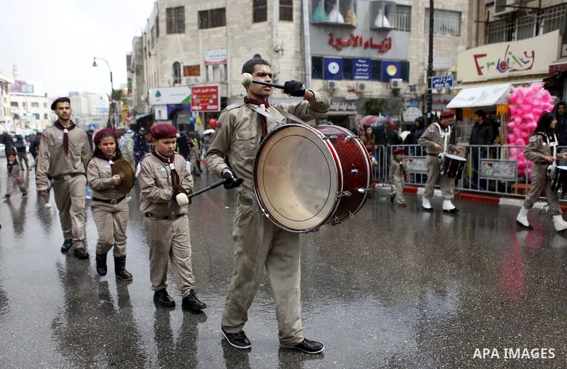 Palestinian Orthodox Christians celebrate the arrival of the 'Holy Fire' from Jerusalem's Holy Sepulchre in the occupied West Bank city of Ramallah April 11, 2015. Photo by Shadi Hatem