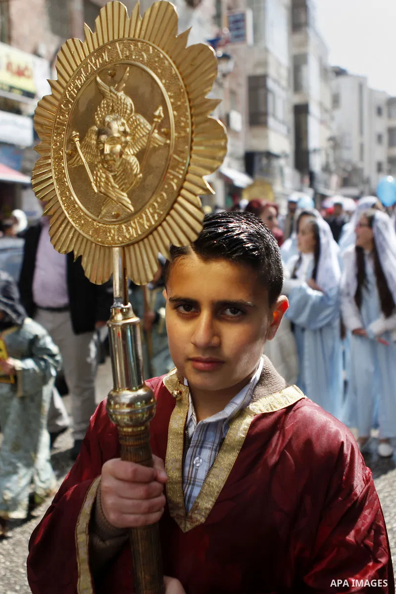 Palestinian Orthodox Christians celebrate the arrival of the 'Holy Fire' from Jerusalem's Holy Sepulchre in the occupied West Bank city of Ramallah April 11, 2015. Photo by Shadi Hatem