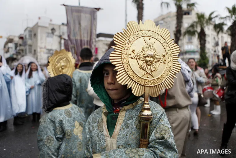 Palestinian Orthodox Christians celebrate the arrival of the 'Holy Fire' from Jerusalem's Holy Sepulchre in the occupied West Bank city of Ramallah April 11, 2015. Photo by Shadi Hatem