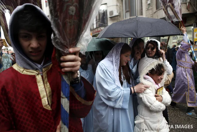 Palestinian Orthodox Christians celebrate the arrival of the 'Holy Fire' from Jerusalem's Holy Sepulchre in the occupied West Bank city of Ramallah April 11, 2015. Photo by Shadi Hatem