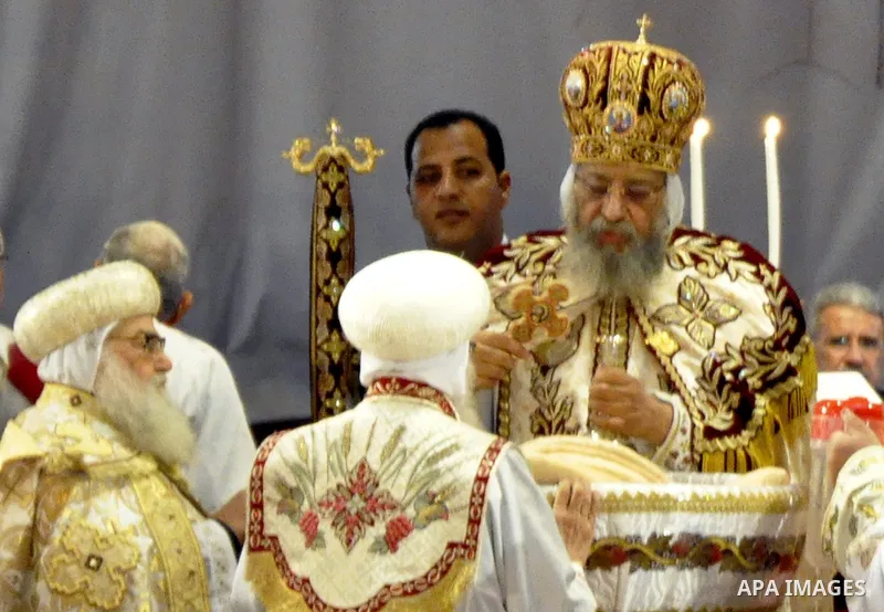 Coptic Pope Tawadros II, head of the Coptic Orthodox church, takes part in a ritual as part of a Coptic Orthodox Easter mass at the main cathedral in Cairo April 11, 2015. Photo by Amr Sayed