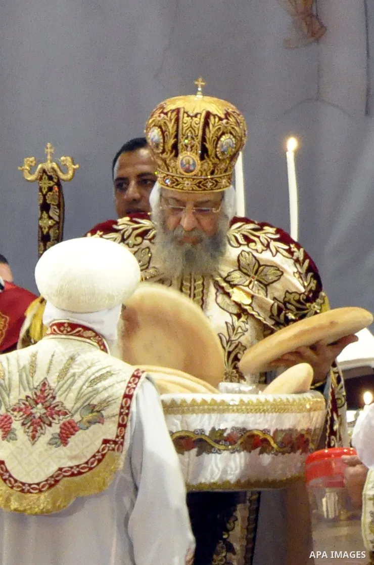 Coptic Pope Tawadros II, head of the Coptic Orthodox church, takes part in a ritual as part of a Coptic Orthodox Easter mass at the main cathedral in Cairo April 11, 2015. Photo by Amr Sayed