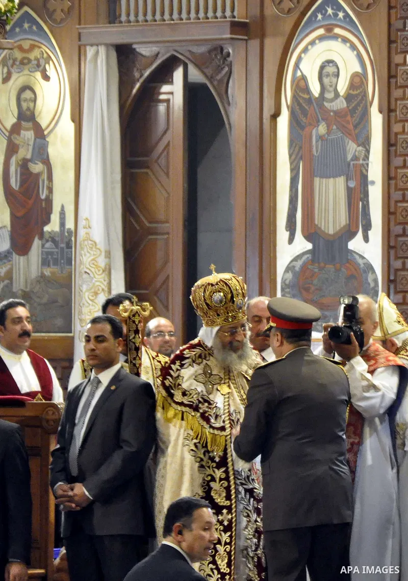 Coptic Pope Tawadros II, head of the Coptic Orthodox church, takes part in a ritual as part of a Coptic Orthodox Easter mass at the main cathedral in Cairo April 11, 2015. Photo by Amr Sayed
