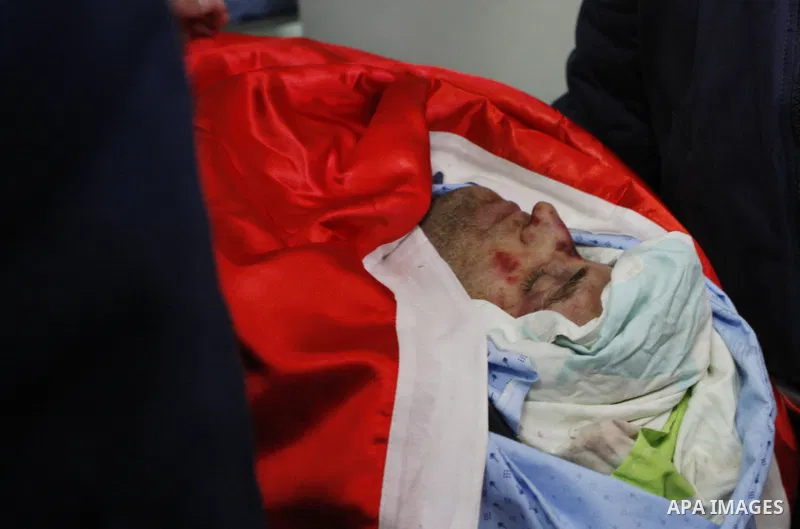 Palestinians gather around of the body of Mohammed Karara, after his delivered by Israeli forces at a hospital in the West Bank city of Ramallah on April 12, 2015. Karara killed by Israeli forces after injuring two Israe...