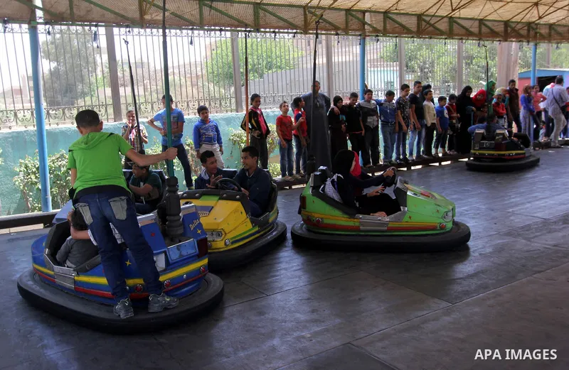 Egyptian children play at the Jabanese botanical garden in Helwan city, north of Cairo on April 13, 2015. Egyptians celebrate the Sham El Nessim, or the Festival of Spring Breeze, which marks the beginning of spring. Pho...