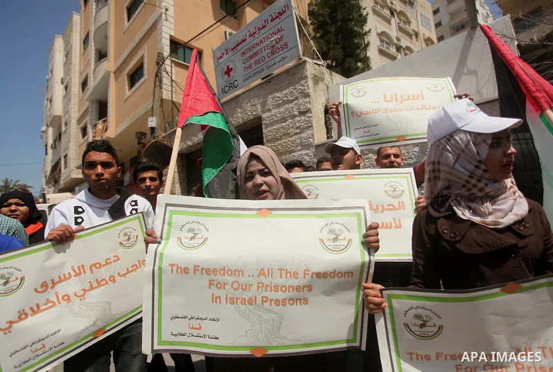 Protesters take part in a protest marking Palestinian Prisoners' Day in front of Red cross office in Gaza City April 19, 2015. Palestinian human rights groups say 6,000 Palestinian prisoners remain in Israeli prisons and...
