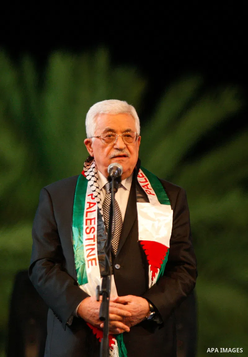 Palestinian President Mahmoud Abbas speaks during the national mass wedding ceremony, in the West Bank city of Jericho, April 20, 2015. Nearly 462 Palestinian couples were married in a ceremony organised by Palestinian p...