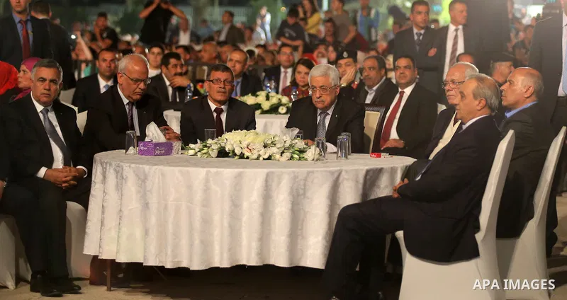 Palestinian President Mahmoud Abbas attends the national mass wedding ceremony, in the West Bank city of Jericho, April 20, 2015. Nearly 462 Palestinian couples were married in a ceremony organised by Palestinian preside...
