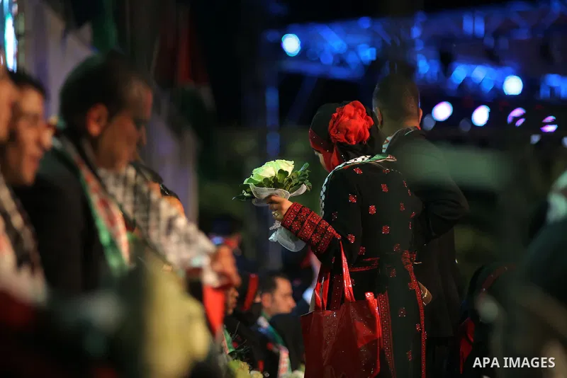 Palestinian couples attend the national mass wedding ceremony, in the West Bank city of Jericho, April 20, 2015. Nearly 462 Palestinian couples were married in a ceremony organised by Palestinian presidency. Photo by Sha...