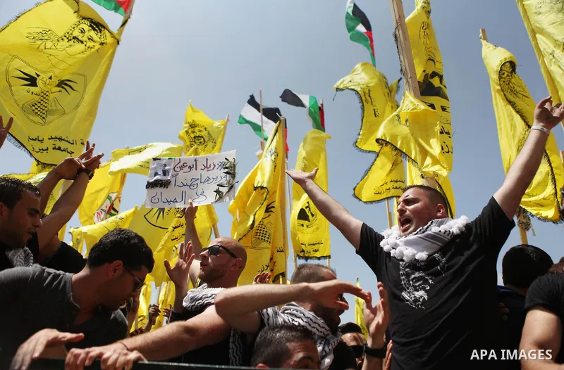 Palestinian supporters of the Islamic Hamas movement and Fatah movement attend a rally prior to the Student Council elections at Birzeit University, on the outskirts of the city of Ramallah in the West Bank on April 21 2...