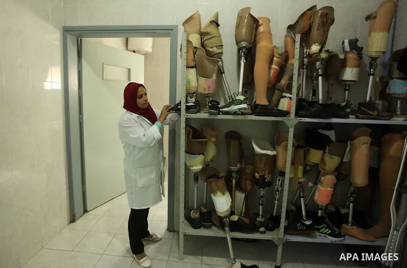 Lana Al-Kronz, 26-year-old Palestinian specialist of prosthetic works on an artificial leg at a center of prosthetic limbs, in Gaza City on April 21, 2015. Al-Krunz is the first Palestinian woman which makes the prosthet...