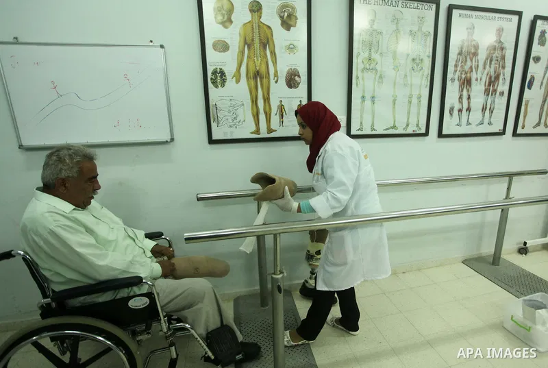 Lana Al-Kronz, 26-year-old Palestinian specialist of prosthetic works on an artificial leg at a center of prosthetic limbs, in Gaza City on April 21, 2015. Al-Krunz is the first Palestinian woman which makes the prosthet...